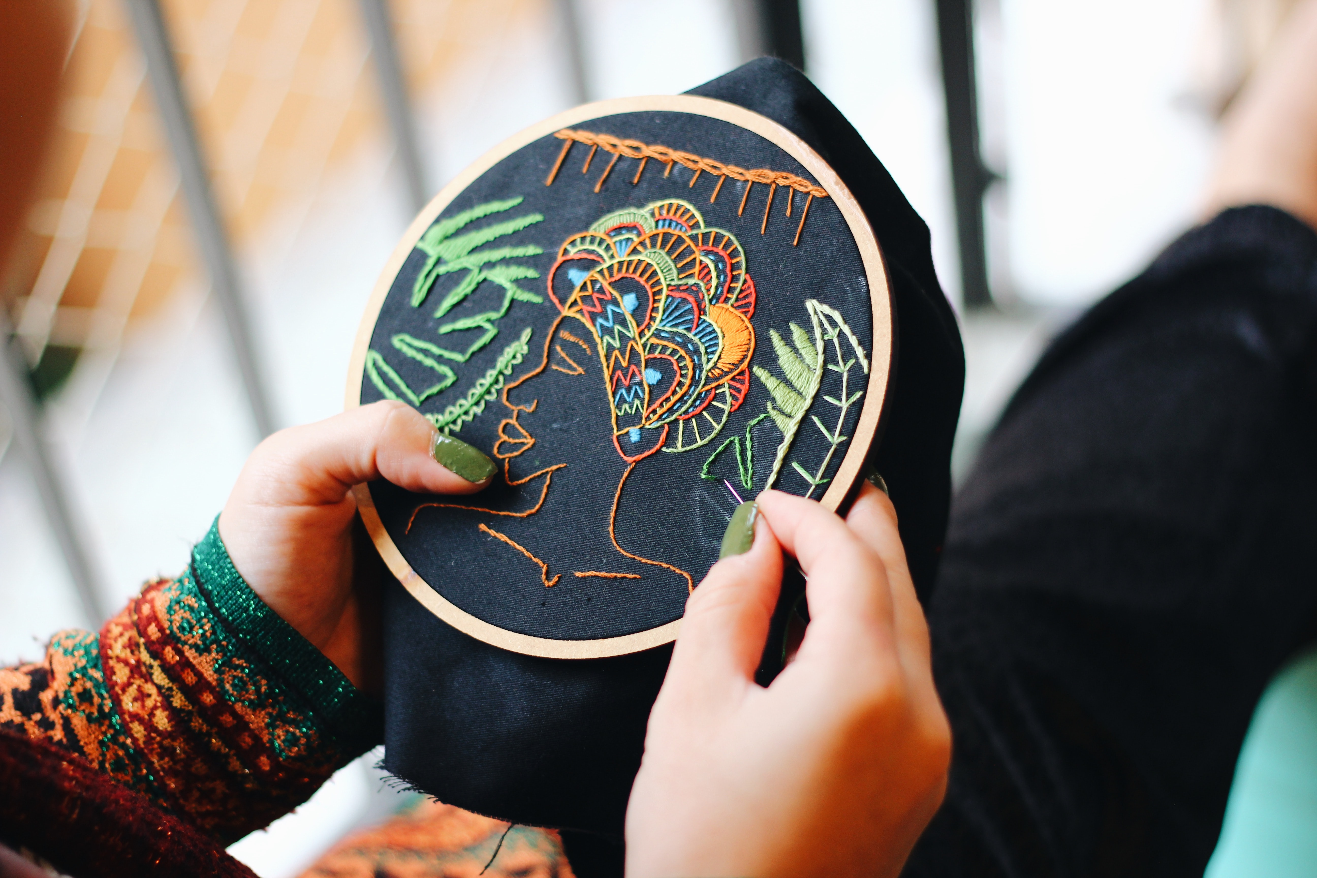 Embroidery of a woman's side profile
